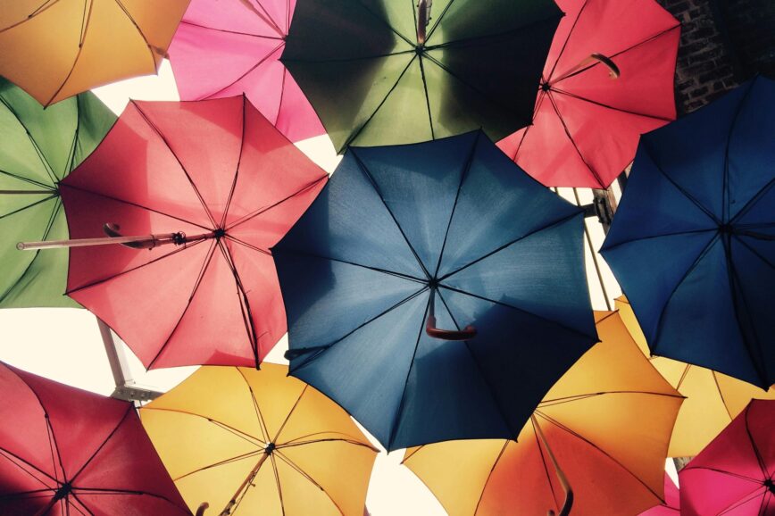 Vibrant umbrellas create a colorful canopy in Greater London, offering protection from sun and rain.