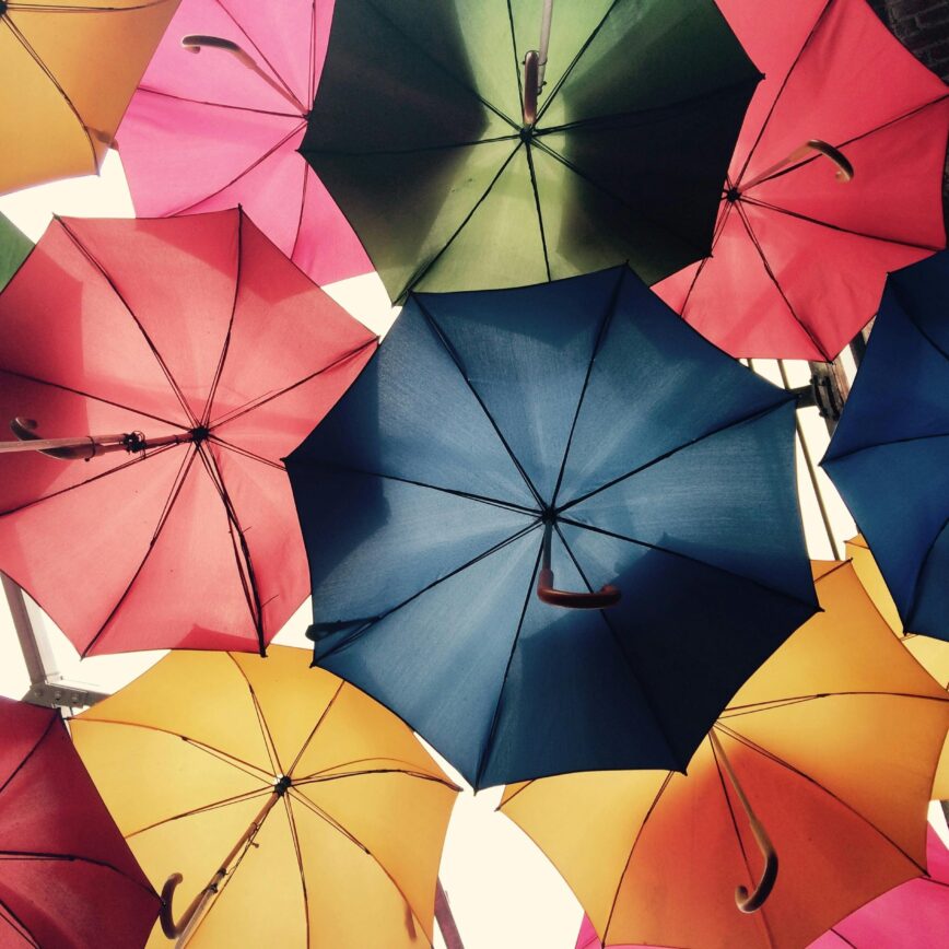 Vibrant umbrellas create a colorful canopy in Greater London, offering protection from sun and rain.