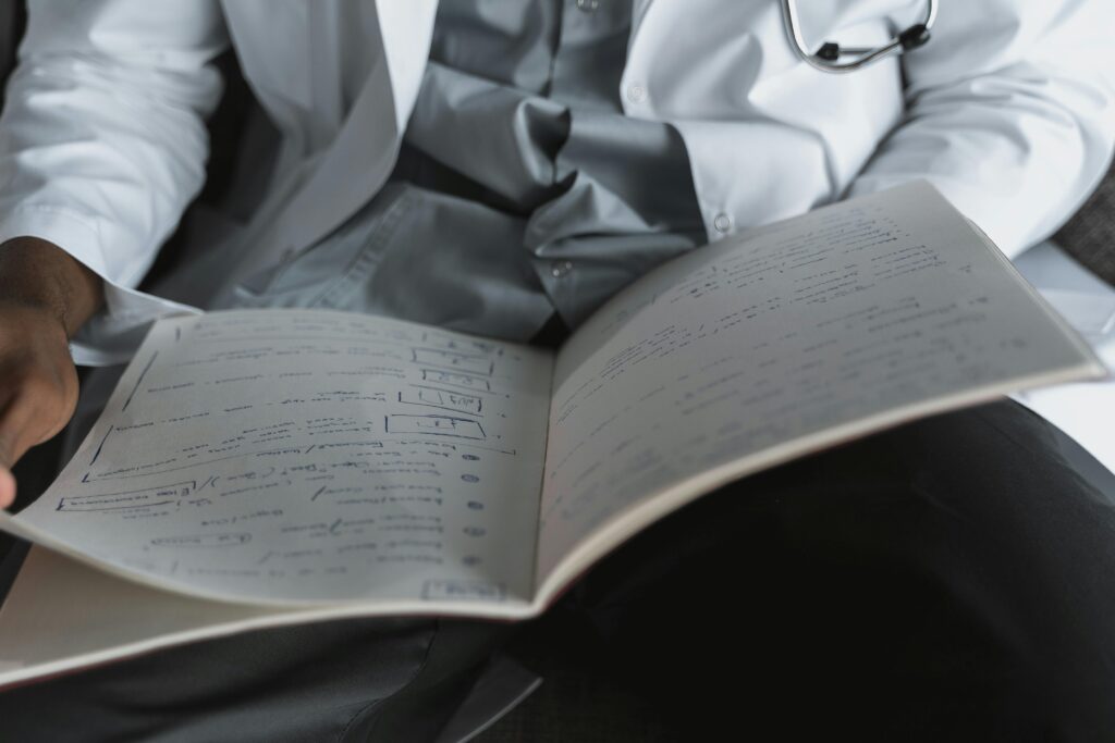 A medical professional reviewing important documents in an office setting.