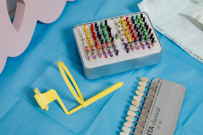 A vibrant collection of dental tools displayed on a sterile blue cloth ready for dental use.