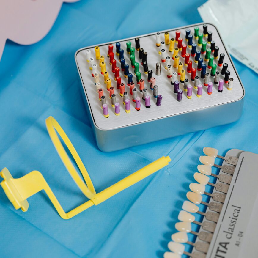 A vibrant collection of dental tools displayed on a sterile blue cloth ready for dental use.