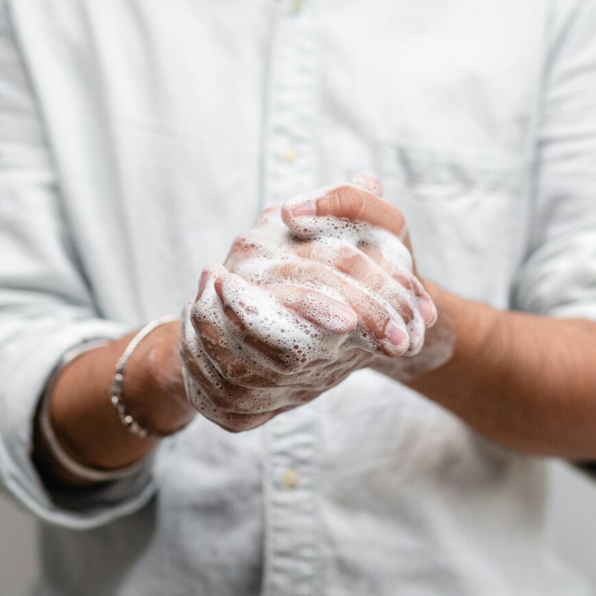 Close-up of hands lathered with soap for thorough cleaning and hygiene.